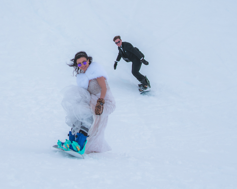 Snowboarders riding on wedding day, Remarkables